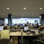 cybersecurity analyst monitoring multiple screens