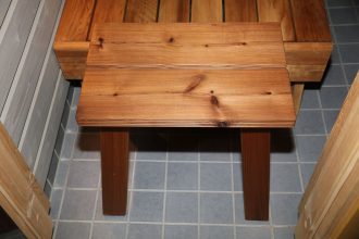 Wooden benches inside a traditional Finnish sauna
